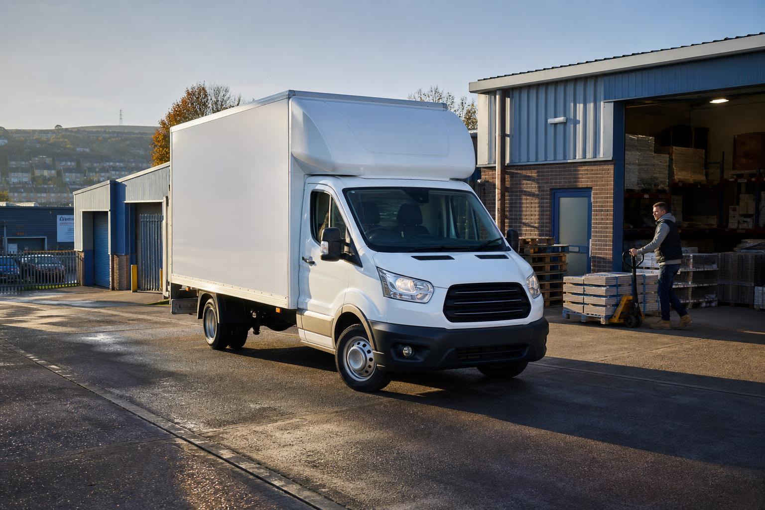 White Luton hire van preparing for a business delivery in an Elland industrial yard